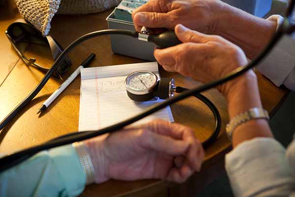 A member getting their blood pressure checked