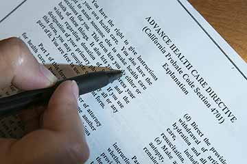 Someone filling out an Advance Care Directive form