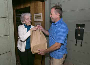 A meal being delivered to a homebound meal recipient 