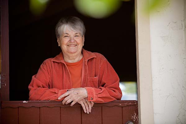 resident smiling from apartment unit door
